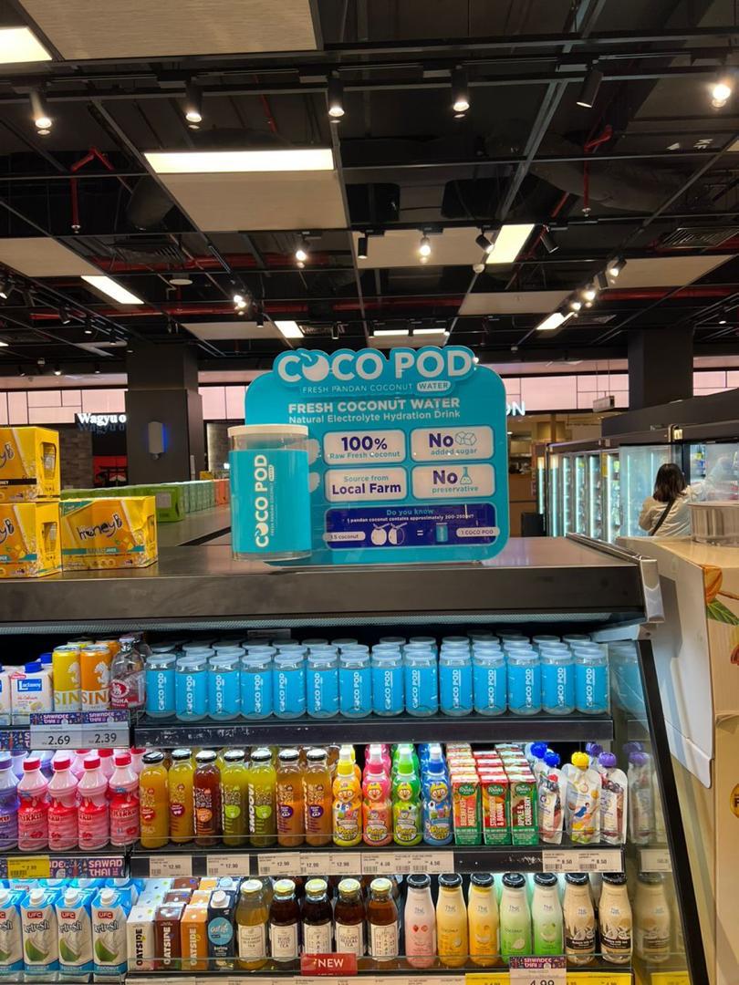 Cocopod on a chilled retail shelf with brand header display